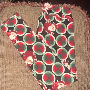 LulaRoe One Size Christmas leggings, NEW, black background, Santa’s, fits 2-10
